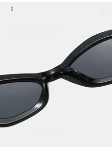 Détail des plaquettes de nez intégrées sur lunettes de soleil œil de chat noires de luxe