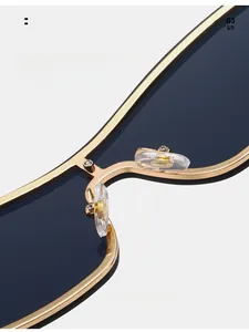 Close-up of adjustable silicone nose pads and gold metal frame on hip hop sunglasses