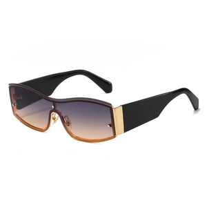 Chic oversized shield sunglasses with orange gradient lenses and gold metal accents