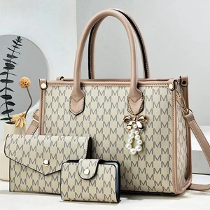 Three-piece beige tote bag set with M-pattern print and elegant pearl tassel pendant
