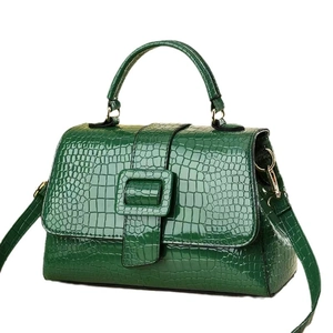 Elegant green crocodile pattern handbag with glossy finish and square buckle detail