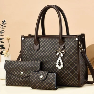 Brown geometric tote bag three-piece set with pearl bow charm and envelope clutch