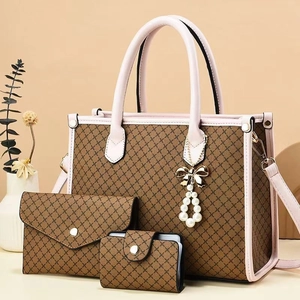 Three-piece brown tote bag set with pink trim and pearl bow charm in warm scene