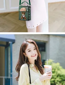 Detail of green crocodile texture mini crossbody bag with cute bear patch and knit cap