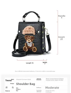 Detailed size chart for a black crocodile texture crossbody bag with bear embroidery