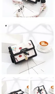 Close-up of vintage print small square bag with colorful stamps and Eiffel Tower pattern