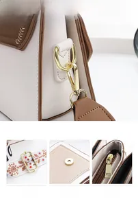 Détails du sac à bandoulière crème avec sangle jacquard et finitions métalliques dorées