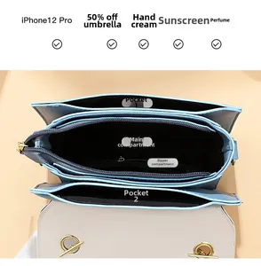 Internal view of crossbody bag showing multiple compartments for phone and cosmetics