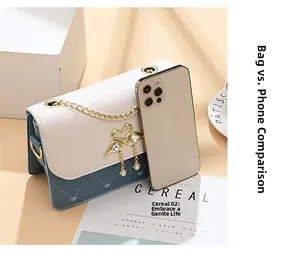 Detail shot of a small square crossbody bag showing size compared to a mobile phone