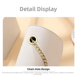 Detail of adjustable gold chain strap on pink leather bag with durable plated hardware