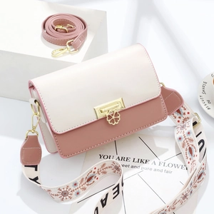 Mini sac bandoulière avec fermoir fleur, empiècements contrastés et deux lanières