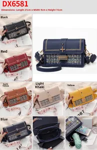 Detail view of colorful patchwork crossbody bag with floral clasp and wide ethnic strap