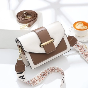 Sac bandoulière rétro bicolore avec boucle dorée et sangle tissée réglable
