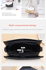 Detail view of printed crossbody bag showing multiple inner compartments and pearl charm