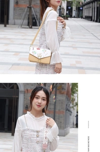 Chic crossbody bag with hot air balloon print and pearl charms shown in street style