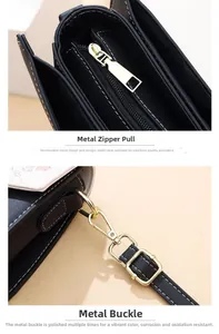 Detailed macro view of polished gold hardware and zipper on the black leather handbag