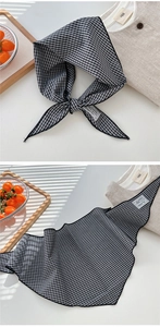 Detail of checkered cotton linen scarf with vintage label and fine stitched edges