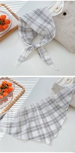 Detail of plaid cotton linen neckerchief with delicate white lace embroidery label