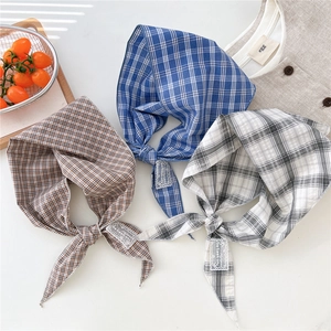 Three cotton linen plaid scarves in brown, blue, and off-white with lace labels