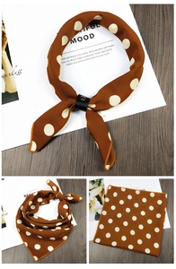 Detail view of dark brown polka dot square scarf with leather ring and flat layout