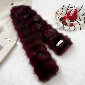 Detail of soft burgundy faux fur scarf with stripes and premium branded woven label