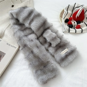 Detail shot of soft faux fur scarf in light grey with premium Epmetheus brand patch
