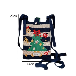Detailed view of the 23cm by 14cm Christmas knit crossbody bag with size dimensions