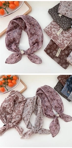 Detailed view of lightweight cotton-linen floral scarves with explore infinity woven label