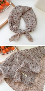 Detail of vintage floral cotton linen scarf with elegant explore infinity woven label