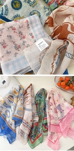 Detail of the cotton linen blend fabric texture and washing label for small square scarves