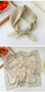 Detailed view of polka dot cotton linen neck scarf with purple trim in a fresh setting