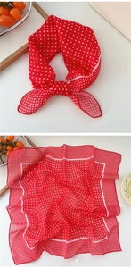 Detail of red and white polka dot cotton linen square scarf with delicate hemmed edges
