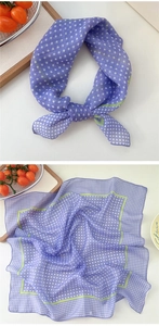 Detail view of purple polka dot scarf showing lightweight texture and soft lavender tones