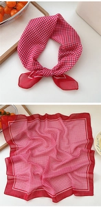 Detail of red and white gingham cotton linen scarf with picnic style aesthetic