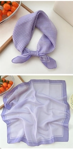 Detail of purple gingham square scarf with fine white hem and lightweight texture