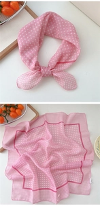 Detail of pink polka dot cotton linen square scarf with fine stitching and wash label