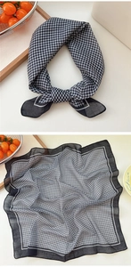 Detail of checkered cotton linen scarf featuring black wide borders and semi-sheer fabric