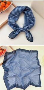Macro detail of blue and white gingham cotton linen square scarf with fine rolled edges