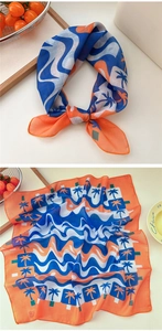 Detail of square cotton-linen scarf with tropical palm tree patterns and geometric prints