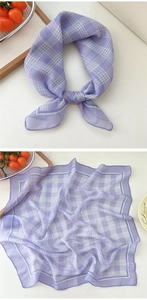 Detail of purple plaid cotton linen scarf showing soft texture and delicate hemmed edges