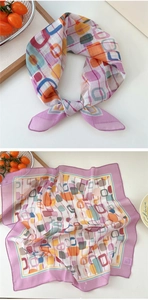 Detailed view of polka dot pattern on purple and orange cotton linen neck scarf