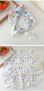 Close-up of cotton linen scarf featuring colorful watercolor polka dots and soft texture