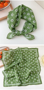 Detail of green floral square scarf with white daisy print and striped borders