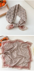 Detail of oat-colored cotton linen square scarf with black dots and geometric patterns