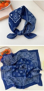 Macro detail of navy blue paisley cotton linen scarf with elegant floral patterns