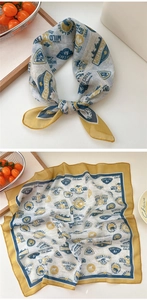 Detail of vintage square scarf showing nodes, mountain badges and yellow borders
