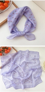 Detailed view of a purple cotton linen scarf featuring red cherry and paisley patterns