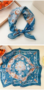 Detail of printed cotton linen square scarf with blue floral, moon, and bird patterns