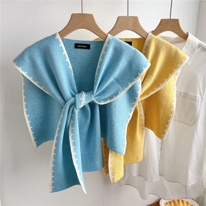 Women's knitted waffle shawl wrap with tie closure and zigzag edges in blue and yellow