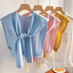 Knitted 100% wool hollow shawl in blue, pink, and yellow over white shirt